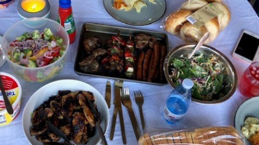 BBQ food and salad on table