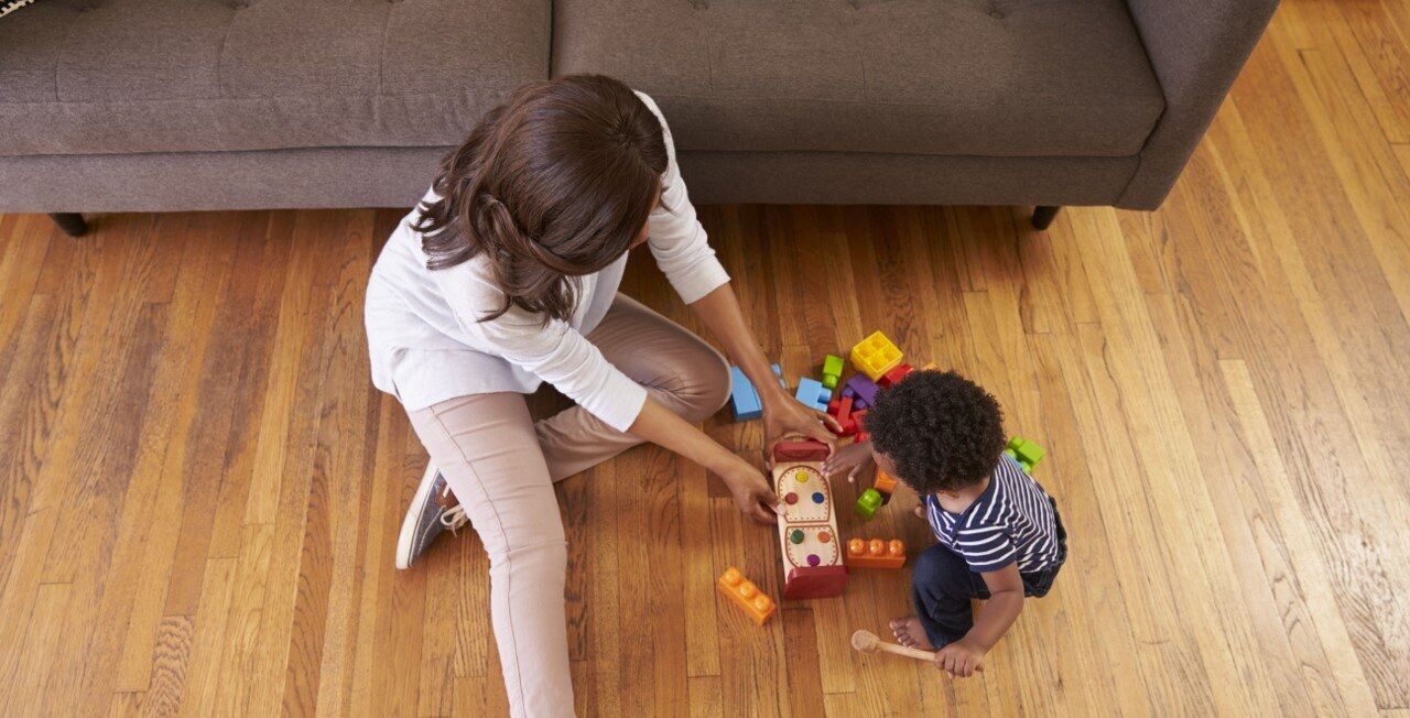 Mother playing blocks with toddler