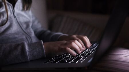 Child using laptop computer