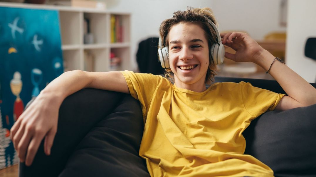 boy with headphones smiling