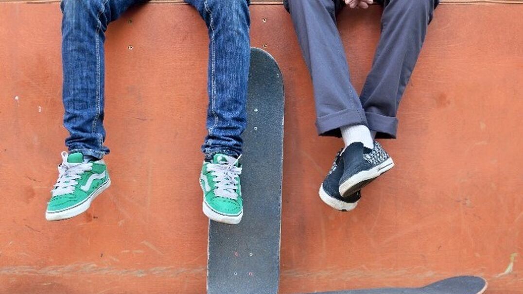 two boys with skateboard